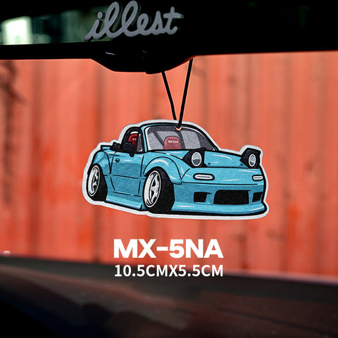 Car air freshener shaped like a blue MX-5NA car on a car dashboard with 'illest' branding.