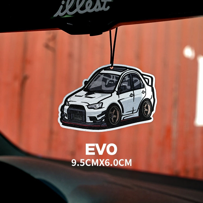 Car air freshener shaped like a white car with 'illust' branding on an orange background