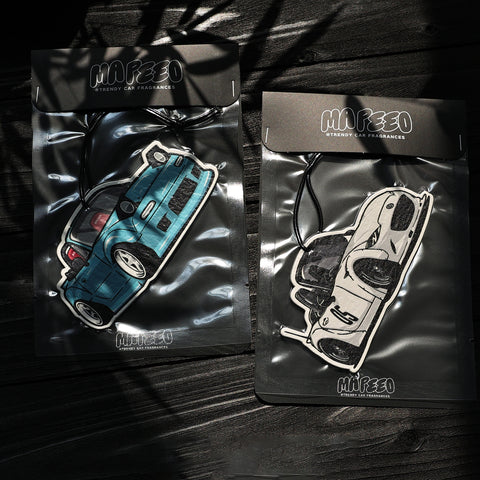 Two packages of Mafeeo car fragrances with car illustrations on a dark background
