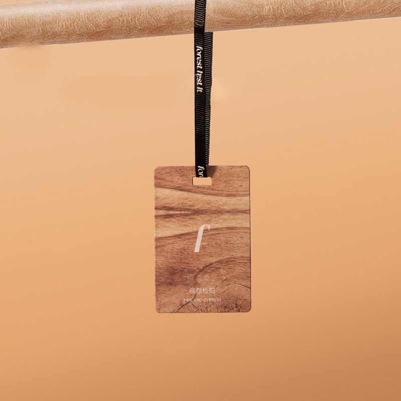 Wooden tag with a strap on a beige background