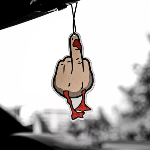 Car air freshener shaped like a duck with a middle finger gesture hanging from a car's rearview mirror.