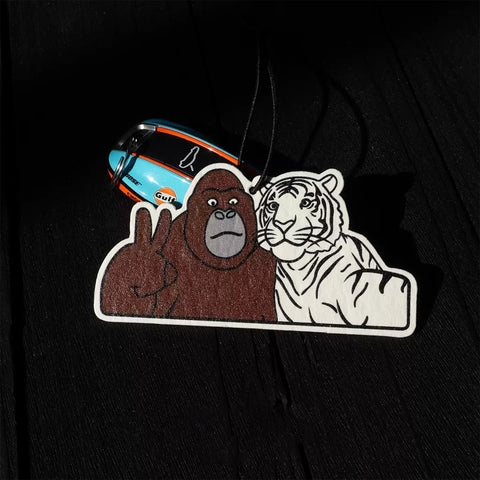 Sticker with a gorilla and tiger design on a black background
