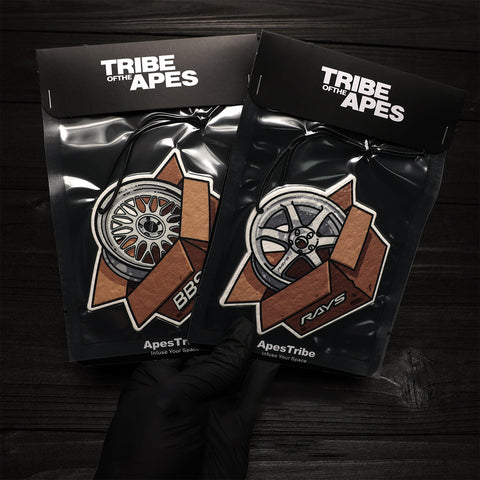 Two black packages with 'Tribe of the Apes' branding on a dark background