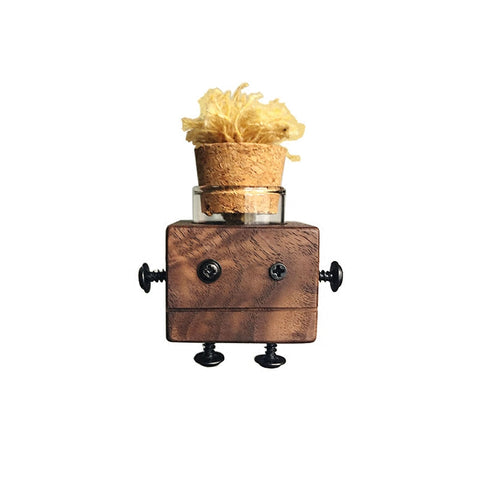 Wooden robot figure with a glass container and cork stopper on a white background