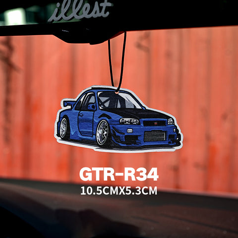 Car air freshener with a blue GTR-R34 design hanging from a car's rearview mirror.
