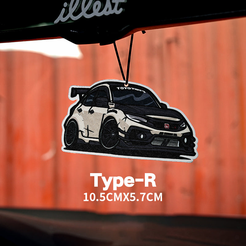 Car air freshener with a toyota type-r design on a wooden background