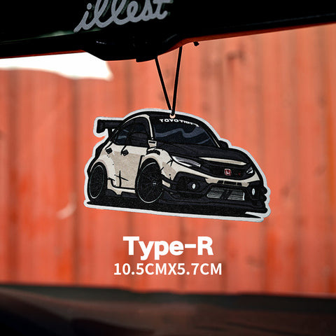 Car air freshener with a toyota type-r design on a wooden background
